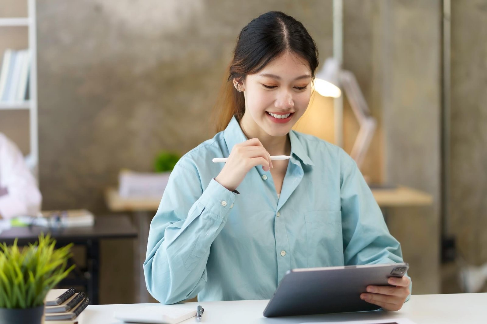 portrait-of-young-asian-business-woman-using-digital-tablet-in-the-office-.jpg